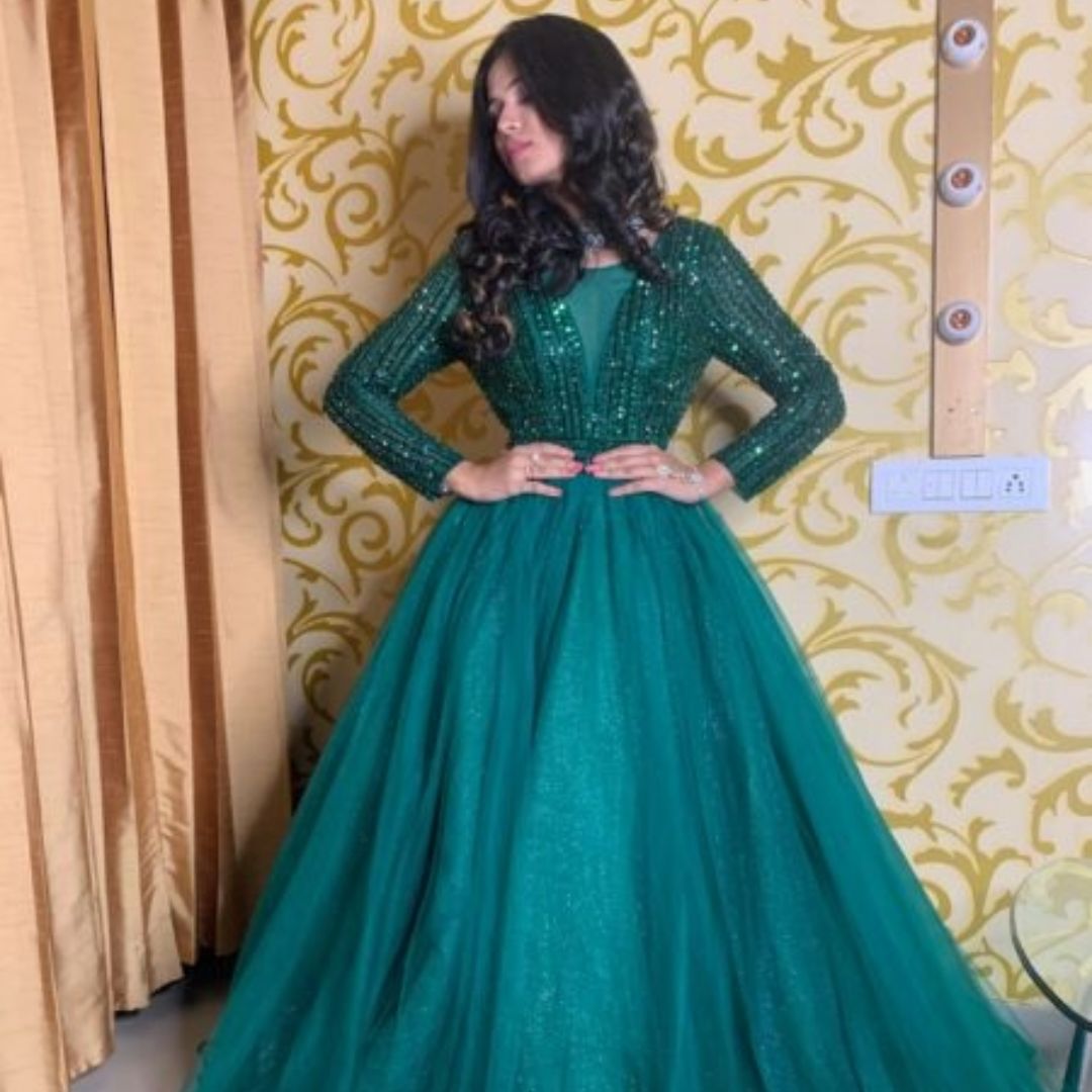 Elegant woman wearing a flowing Gown for Bridesmaid at a wedding ceremony.