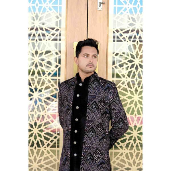 A groom wearing a luxurious designer sherwani Rnetal from Fancyano's rental collection, exuding sophistication and style. #DesignerSherwaniRental"