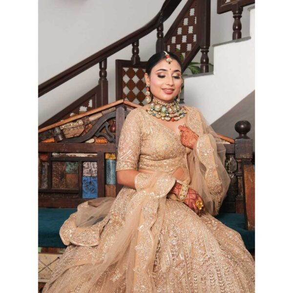 "Golden designer lehenga rental for weddings and special occasions."