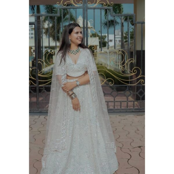 "Exclusive white designer lehenga rental for elegant occasions."