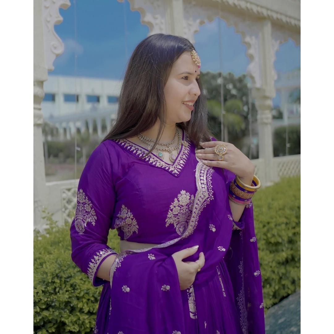 Purple Banarsi Lehenga with intricate golden embroidery available for rent.