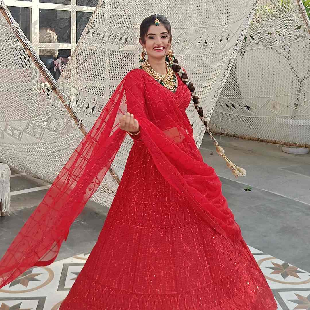 Rent Designer Red Celebrity Lehenga with intricate embroidery and stunning bridal look