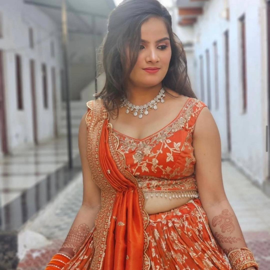 Radiant orange designer lehenga on rent in Udaipur