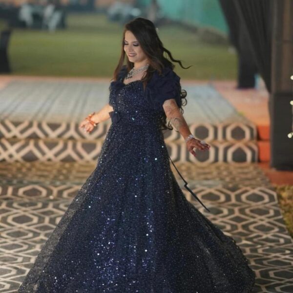Bride wearing a navy-blue western bridal gown with shimmer effect, perfect for rental weddings and evening receptions in Udaipur.