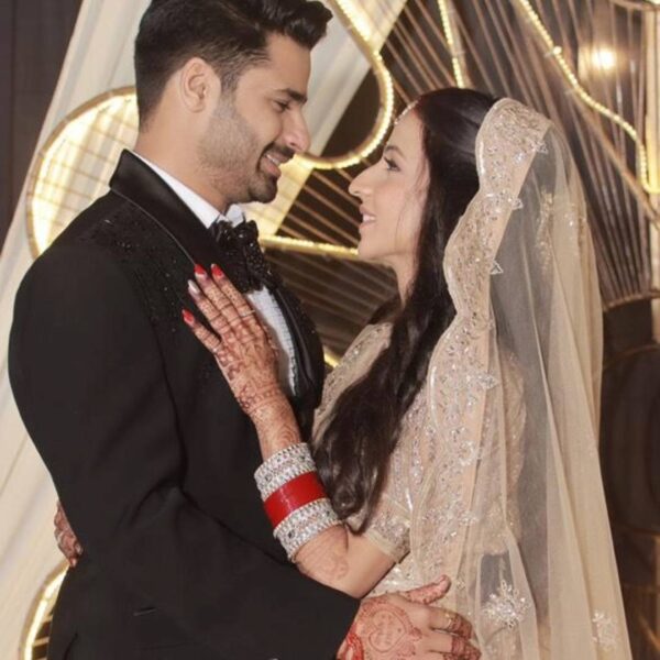 Reception Couple Attire with pastel lehenga and black tuxedo