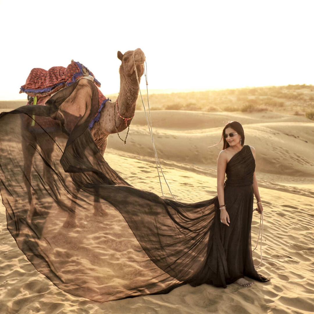 Pre Wedding Black Trail Gown & Suit on rent for couples in Udaipur posing for a stylish pre-wedding photoshoot