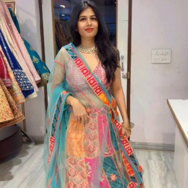 Model wearing a vibrant multicolour lehenga available for rent in Udaipur at Fancyano.