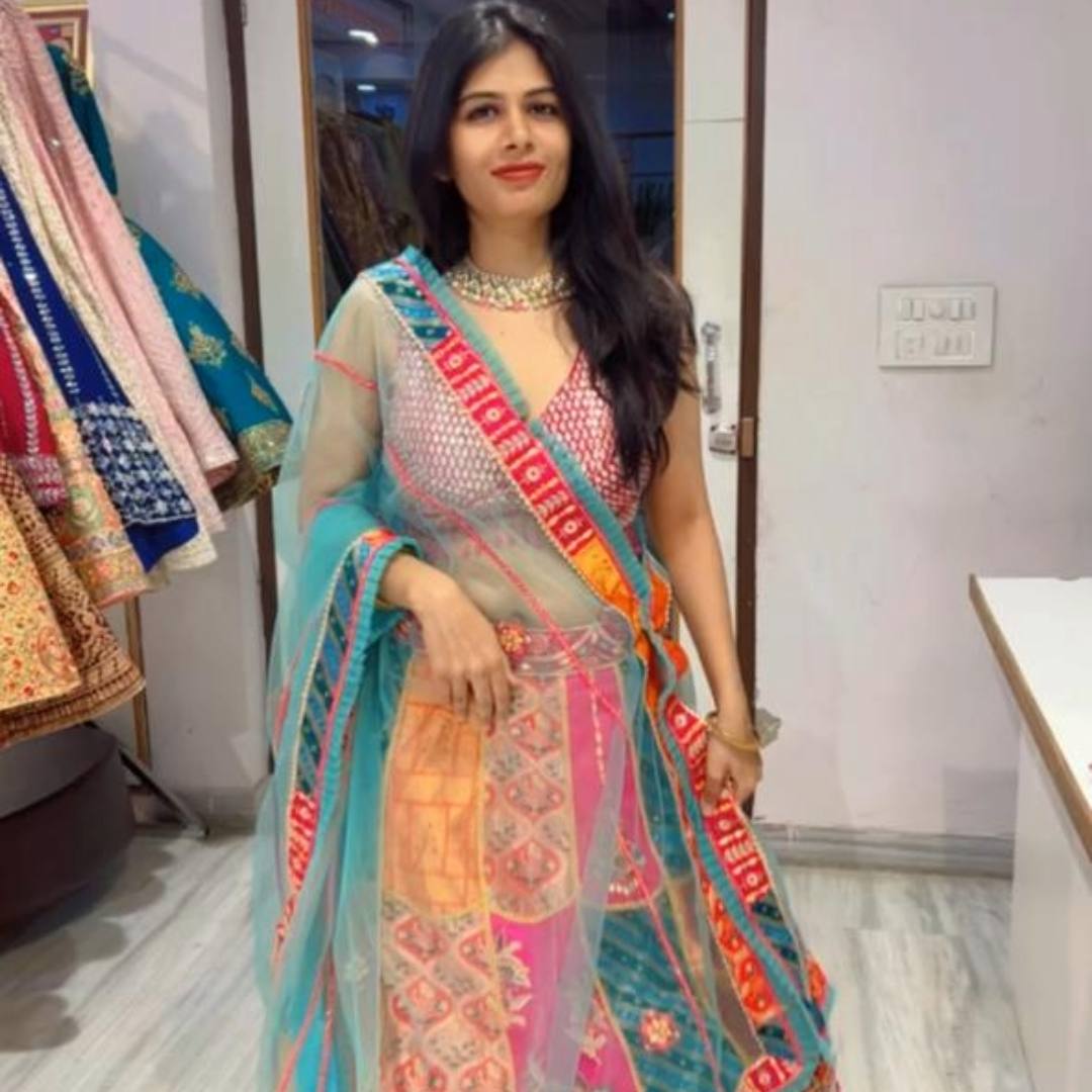 Model wearing a vibrant multicolour lehenga available for rent in Udaipur at Fancyano.