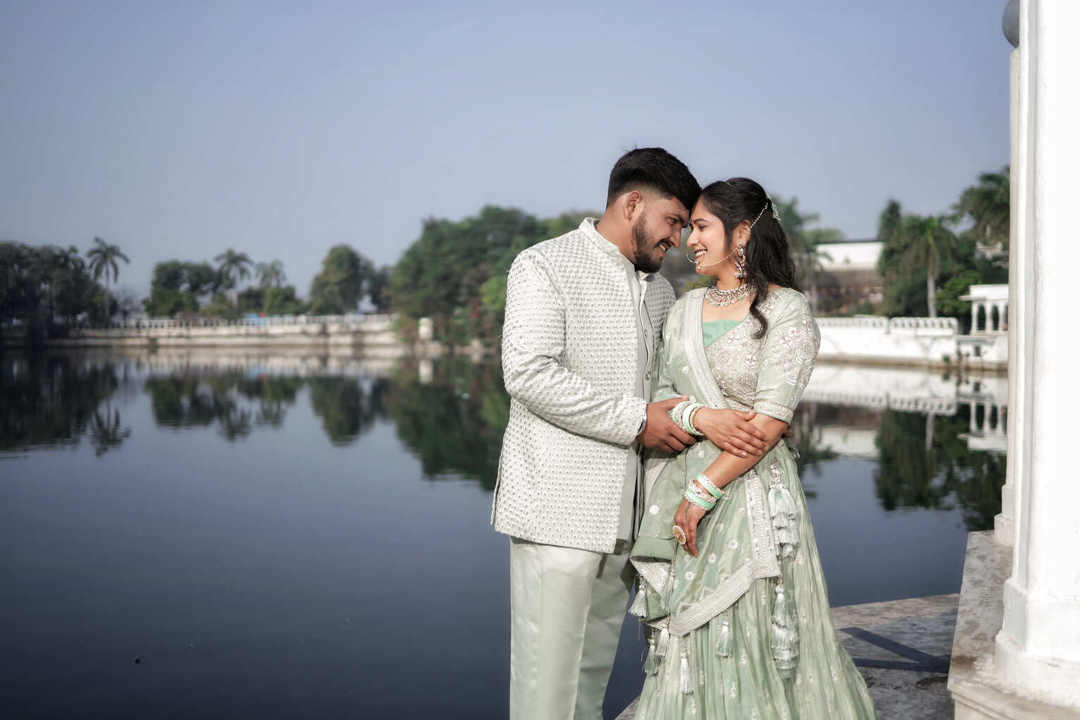 Elegant couple wearing traditional Indian attire – Rent Lehenga & Jodhpuri Combo Dress for royal-themed photoshoots