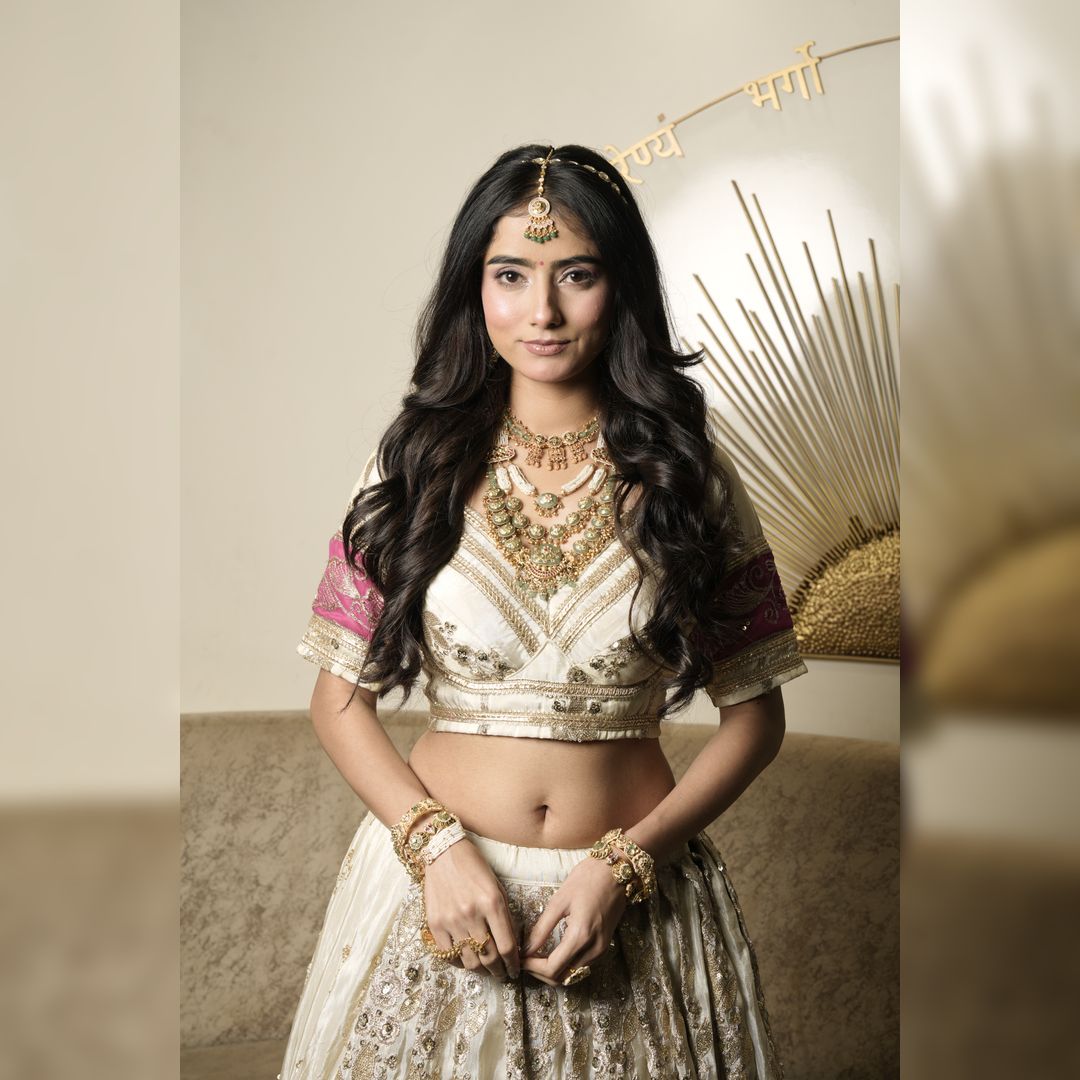 Elegant Cream Golden Bindoli Lehenga rental for weddings in Udaipur