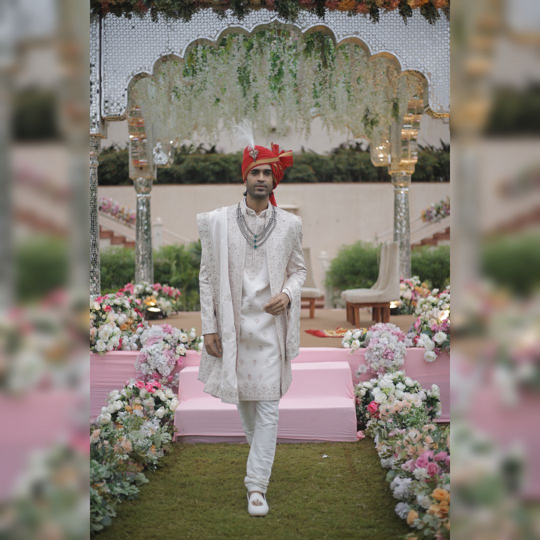 groom wearing ivory wedding sherwani from best sherwani rental store in udaipur fancyano