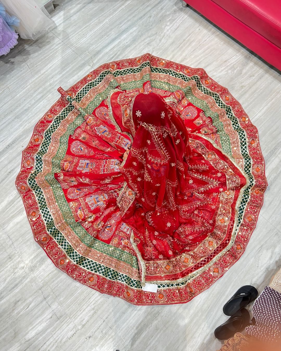 Stylish red Rajasthani look lehenga for photoshoot rental in Udaipur with royal ethnic styling