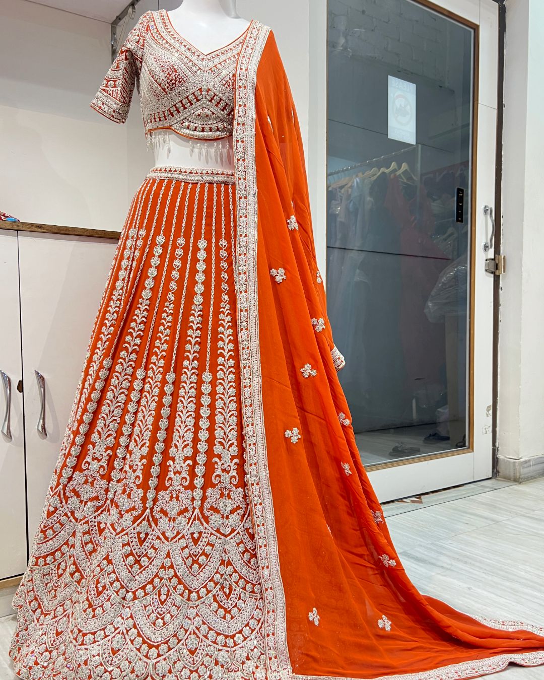 Elegant rust orange lehenga look udaipur for weddings and festive celebrations