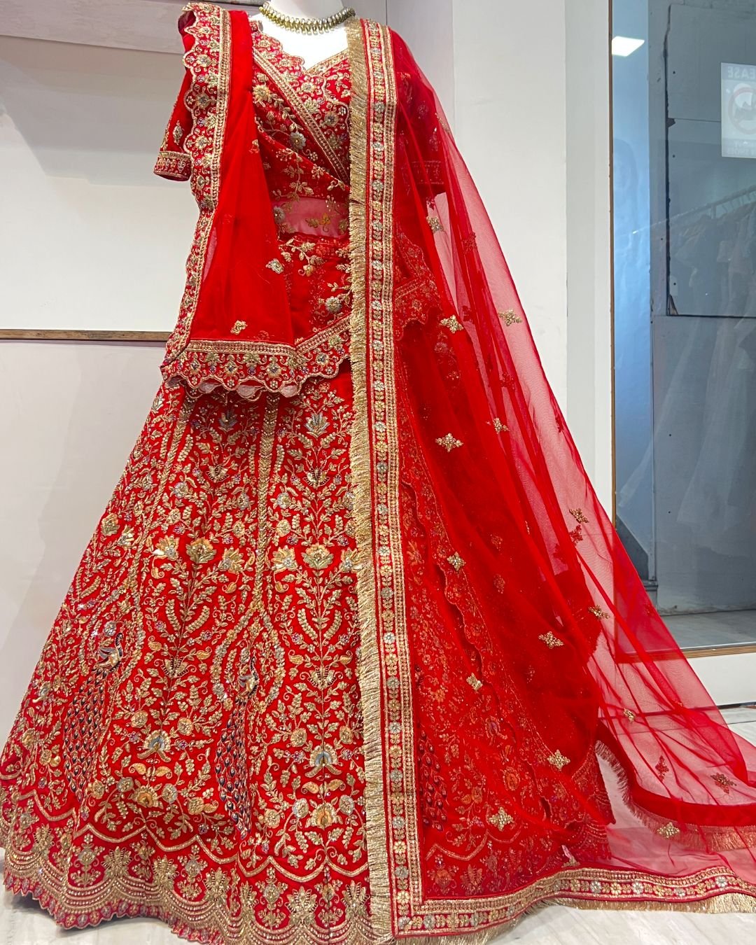 Elegant rent red silk bridal peacock lehenga for bridal weddings and grand celebrations